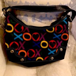 Brand is listed as xoxo. Selling hand bag . No wear or tears